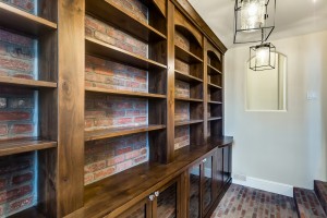  The Artisan Shop, Inc. Built-in storage area, glass front base cabinets
