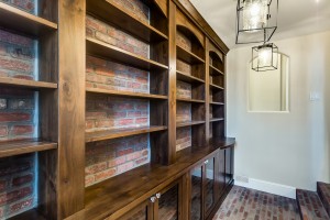 The Artisan Shop, Inc. Built-in storage area, glass front base cabinets